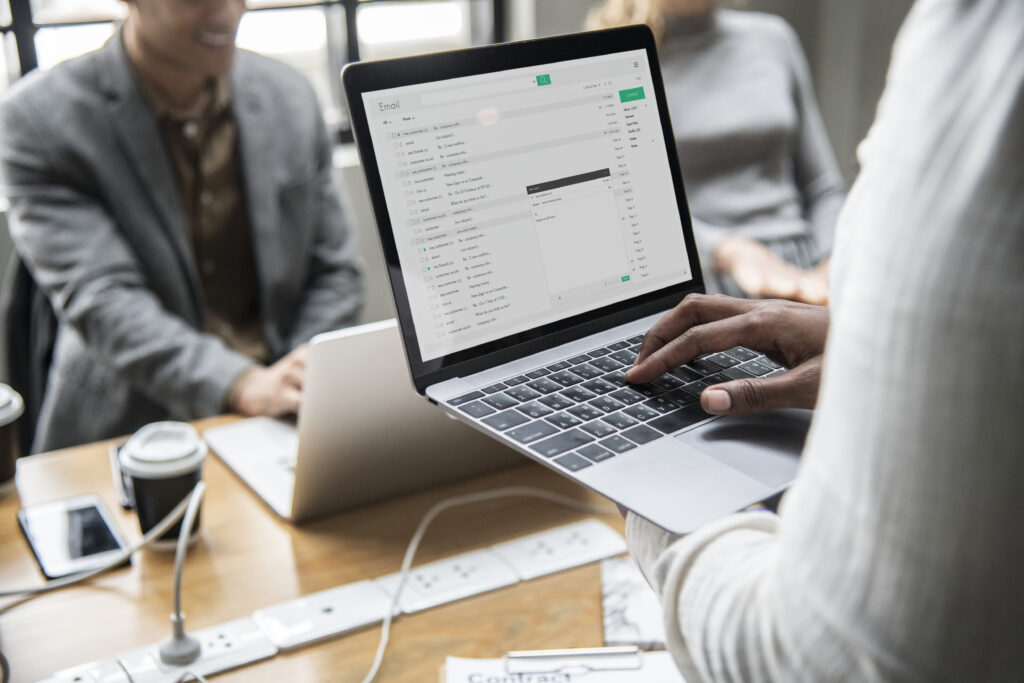man checking his email laptop